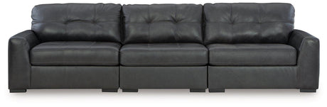 Ashley Furniture Brindley sectional sofa with plush cushions and modern design, shown in a cozy living room setting.