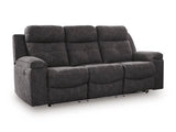 Ashley Furniture Brysonview reclining sofa with plush fabric, shown from an angle with closed recliners and LED lighting off.