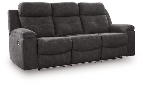 Ashley Furniture Brysonview reclining sofa with plush cushions, dark upholstery, and a modern design viewed from an angle.