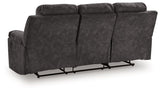 Ashley Furniture Brysonview reclining sofa with plush cushions and reclining feature, shown from the back view.