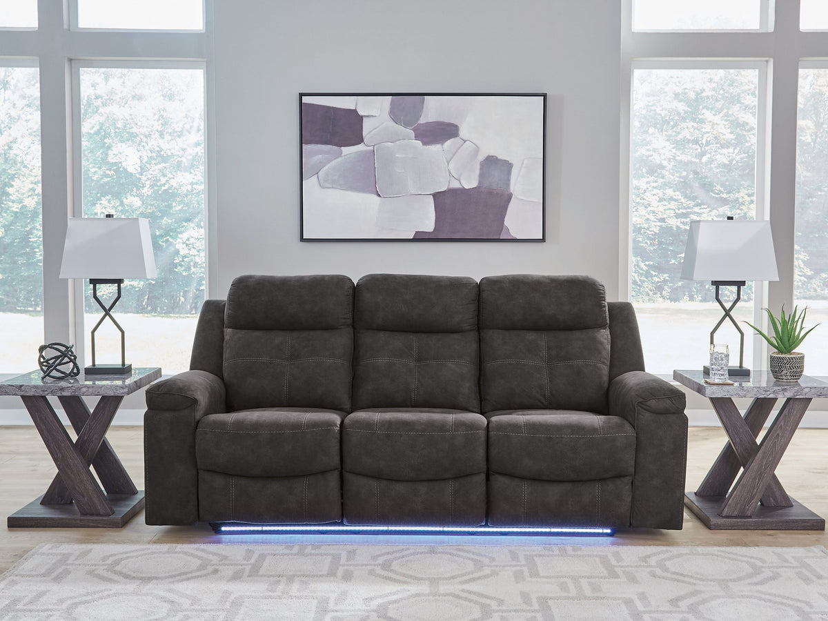 Ashley Furniture Brysonview reclining sofa with white upholstery, featuring plush cushions and a modern design.