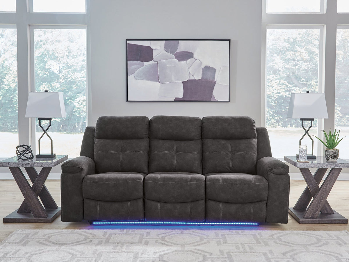 Blue reclining sofa from Ashley Furniture's Brysonview collection, with plush cushions and reclining features in a modern living room setting.