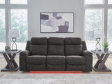 Ashley Furniture Brysonview reclining sofa in red fabric with plush cushions and a modern design, perfect for living room seating.