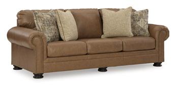 Ashley Furniture Carianna Sofa with plush cushions and neutral fabric, shown in a modern living room setting.
