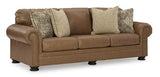 Ashley Furniture Carianna Sofa with plush cushions and neutral fabric, shown in a modern living room setting.
