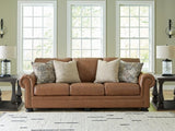 Ashley Furniture Carianna sofa with plush cushions and neutral upholstery, shown in a stylish living room setting.