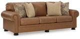 Ashley Furniture Carianna sofa shown from an angle, featuring plush upholstery and modern design in a stylish living room setting.