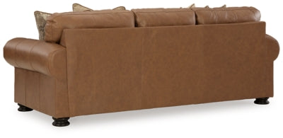 Ashley Furniture Carianna sofa with plush back cushions and wide armrests, shown from the back in a stylish living room setting.