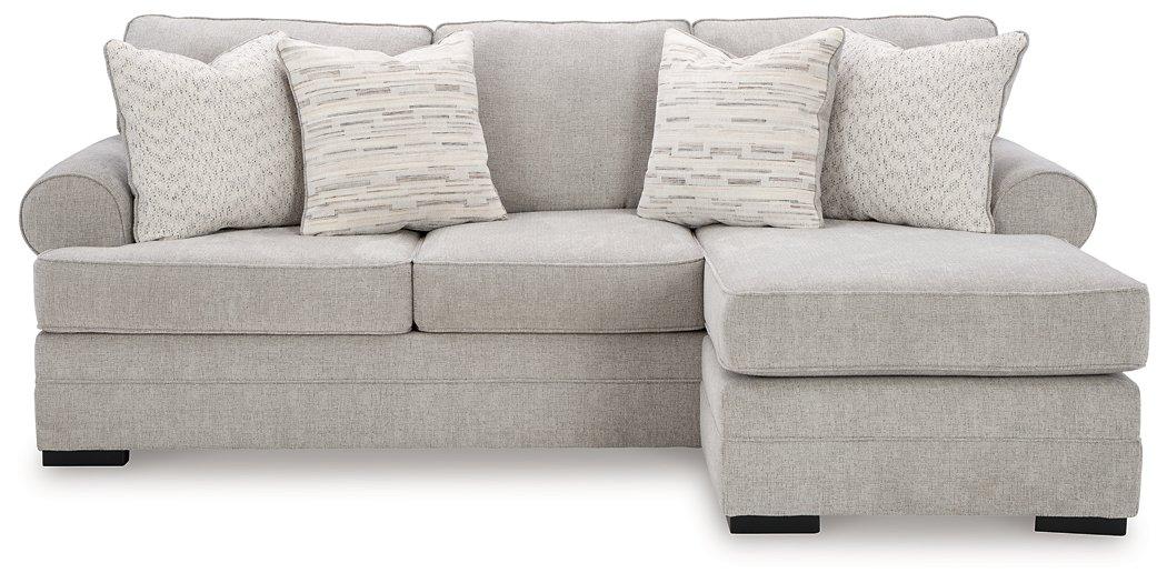 Ashley Furniture Eastonbridge sofa chaise showing plush beige upholstery and modern design with cushioned armrests and a spacious seating area.