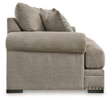 Ashley Furniture Galemore sofa showing plush gray fabric, wide armrests, and cushioned back for comfortable seating.