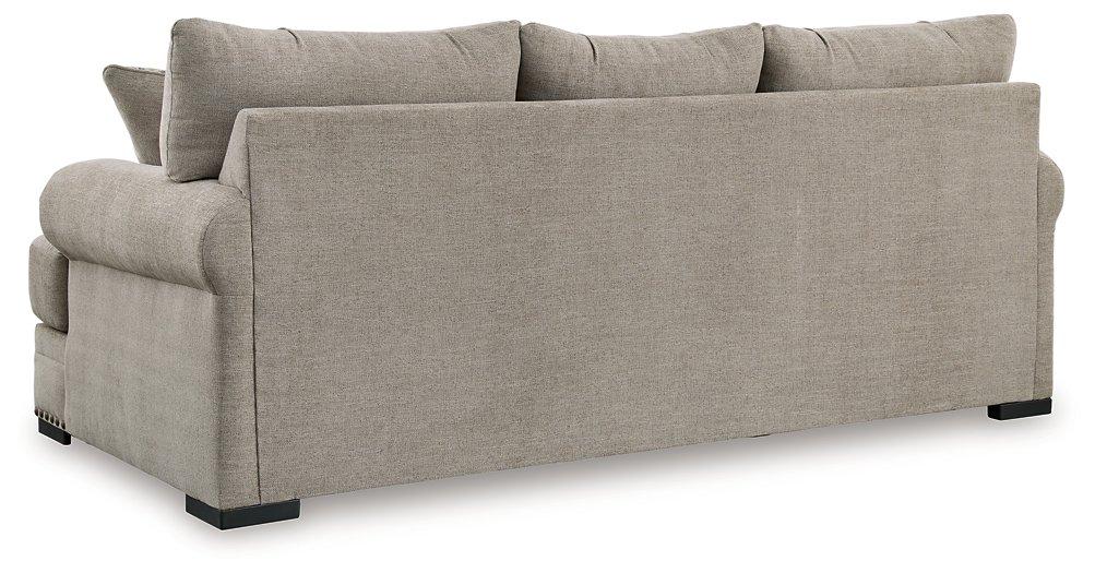 Ashley Furniture Galemore Sofa with plush fabric and cushioned armrests, shown in a modern living room setting.