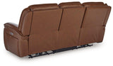 Ashley Furniture Healy Pier Power Reclining Sofa with plush cushions and reclining features, shown in a modern living room setting.