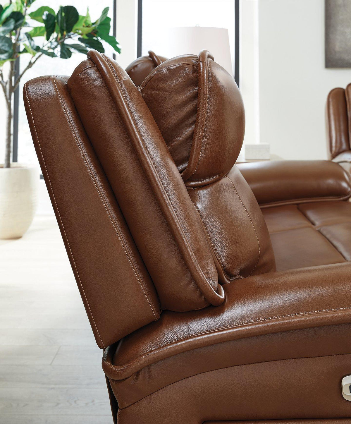 Ashley Furniture Healy Pier Power Reclining Sofa with plush cushions and sleek design, shown in a modern living room setting.