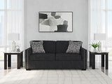 Ashley Furniture Jasmine Peaks sofa with plush upholstery and stylish design, shown in a cozy living room setting.