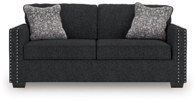 Ashley Furniture Jasmine Peaks sofa with plush cushions and neutral fabric, shown from a head-on view.
