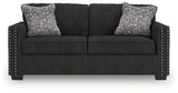 Ashley Furniture Jasmine Peaks sofa with plush cushions and neutral fabric, shown from a head-on view.