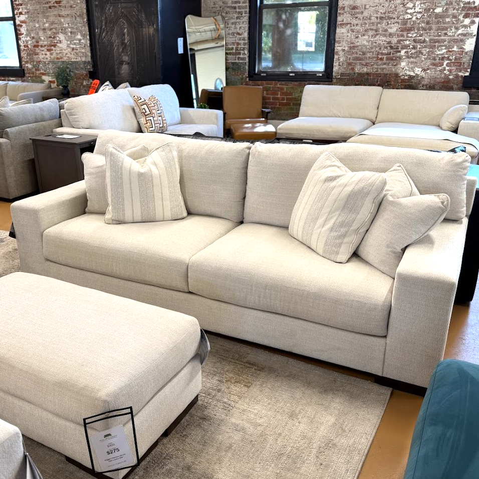 Ashley Furniture Newport Sofa with plush cushions and stylish design, shown in a modern living room setting.