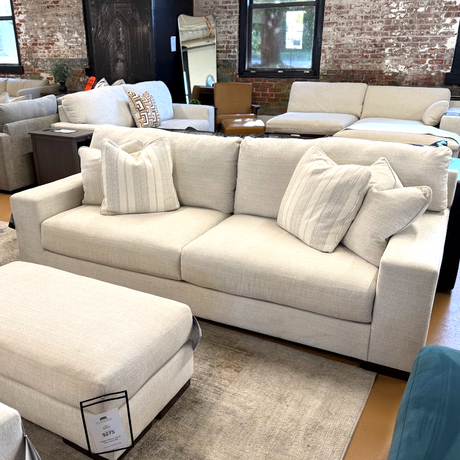 Ashley Furniture Newport Sofa with plush cushions and stylish design, shown in a modern living room setting.