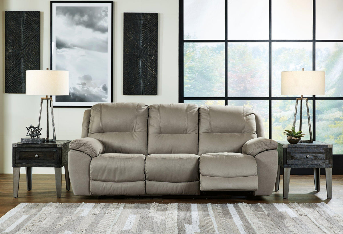 Ashley Furniture Next-Gen Gaucho reclining sofa with plush cushions and modern design, shown in a cozy living room setting.