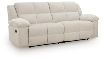 Ashley Furniture Orlen reclining sofa in a closed position, showing plush fabric upholstery and comfortable design from an angled view.