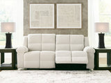 Ashley Furniture Orlen reclining sofa with plush cushions and a neutral fabric upholstery, shown in an open position.
