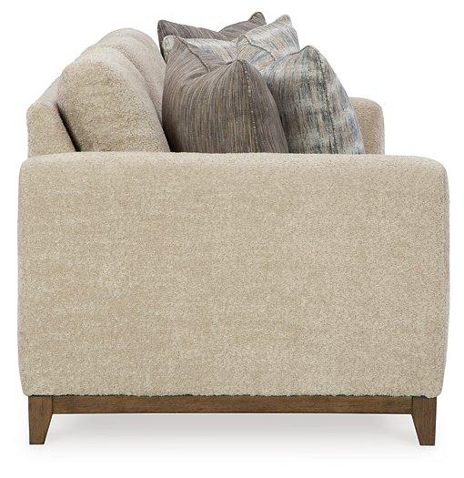 Ashley Furniture Parklynn Sofa, plush fabric upholstery with cushioned back and armrests, in a modern living room setting.