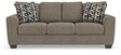 Ashley Furniture Triston-Peaks sofa with plush cushions and neutral fabric, shown from a front head-on angle.