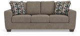 Ashley Furniture Triston-Peaks sofa with plush cushions and neutral fabric, shown from a front head-on angle.