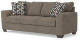 Ashley Furniture Triston-Peaks sofa in a stylish angled view, featuring plush cushions and a contemporary design.