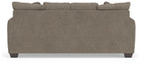 Ashley Furniture Triston-Peaks sofa with plush cushions and wooden legs, shown from the back view.