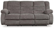 Ashley Furniture Tulen reclining sofa with plush fabric and modern design, shown in a living room setting with multiple reclining seats.