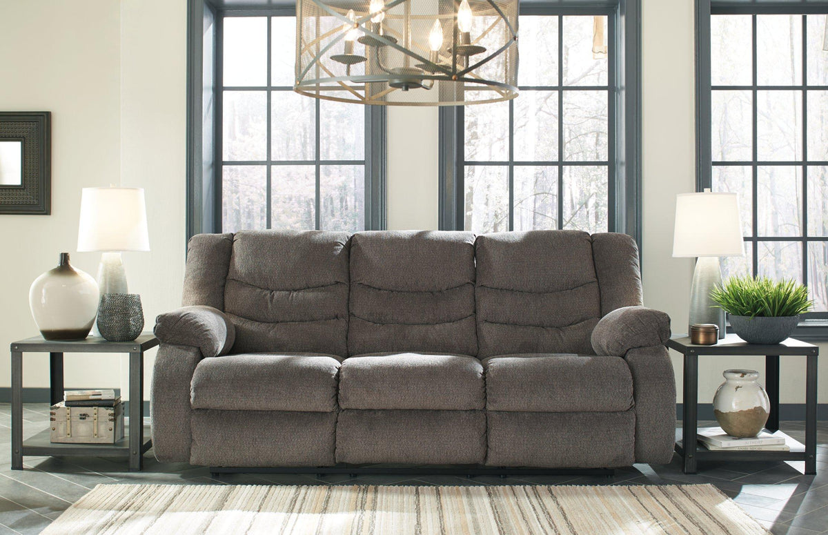 Ashley Furniture Tulen reclining sofa with plush cushions and fabric upholstery, shown in a modern living room setting.