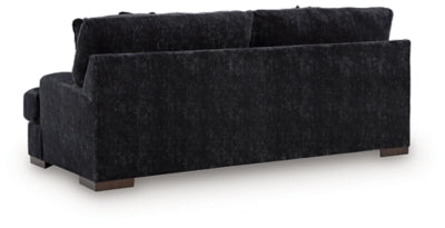 Ashley Furniture Whitmore Manor sofa with plush fabric and elegant design, shown from the back angle.