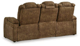 Ashley Furniture Wolfridge power reclining sofa with plush cushions and reclining features, shown in a modern living room setting.
