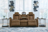 Ashley Furniture Wolfridge power reclining sofa with plush cushions and dark upholstery, showcasing comfortable seating and reclining features.