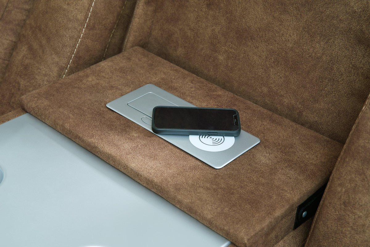 Ashley Furniture Wolfridge power reclining sofa with plush cushions and reclining features, shown in a modern living room setting.