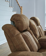 Ashley Furniture Wolfridge Power Reclining Sofa with plush cushions and reclining features, shown in a modern living room setting.