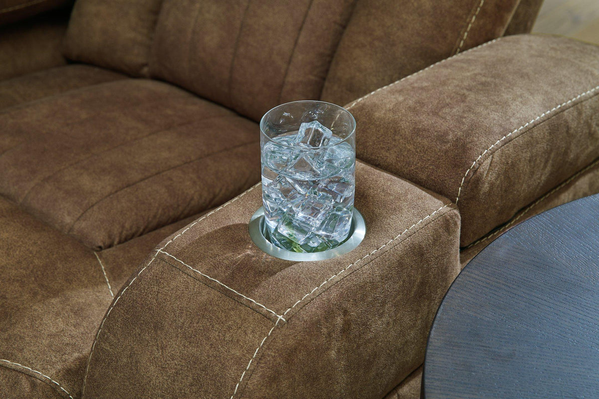 Ashley Furniture Wolfridge power reclining sofa with plush cushions and reclining features, shown in a modern living room setting.