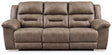 Ashley Furniture Stoneland Power Reclining Sofa with plush cushions and reclining features, shown in a modern living room setting.