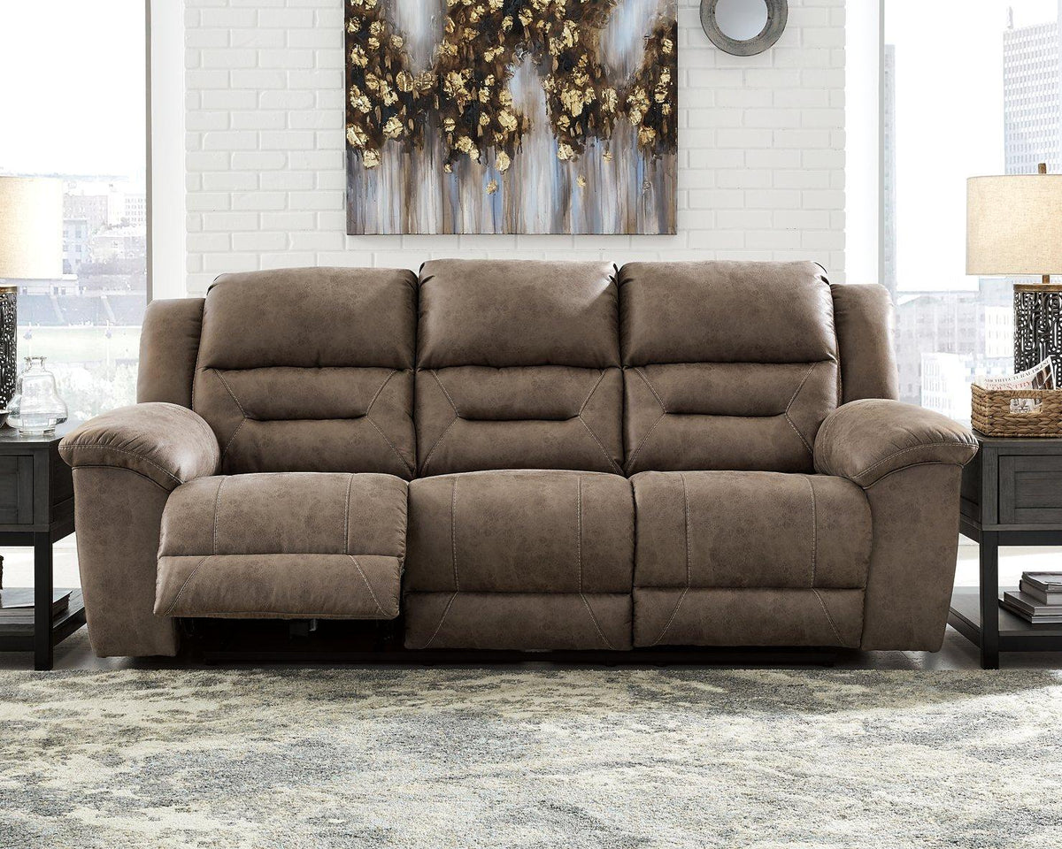 Ashley Furniture Stoneland Power Reclining Sofa with plush fabric and adjustable headrests in a modern living room setting.