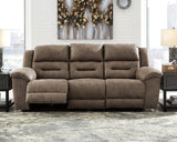 Ashley Furniture Stoneland Power Reclining Sofa with plush fabric and adjustable headrests in a modern living room setting.