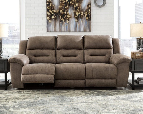 Ashley Furniture Stoneland Power Reclining Sofa with plush fabric and adjustable headrests in a modern living room setting.