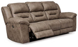 Ashley Furniture Stoneland Power Reclining Sofa with plush cushions and dark leather upholstery, designed for comfort.