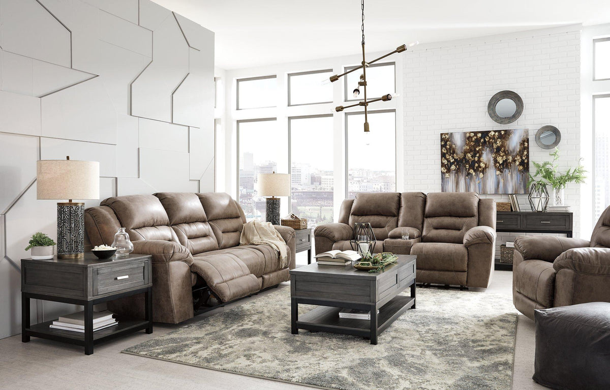 Ashley Furniture Stoneland Power Reclining Sofa with plush cushions and reclining mechanism, in a neutral fabric upholstery.