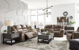Ashley Furniture Stoneland Power Reclining Sofa with plush cushions and reclining mechanism, in a neutral fabric upholstery.