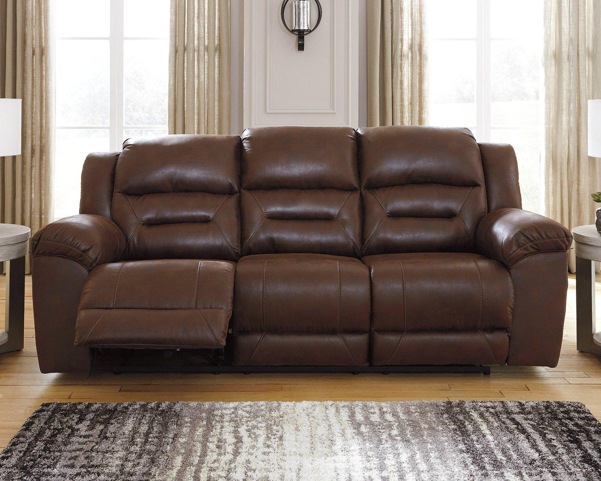 Ashley Furniture Stoneland Power Reclining Sofa showing plush fabric upholstery and reclining features in a modern living room setting.