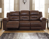 Ashley Furniture Stoneland Power Reclining Sofa showing plush fabric upholstery and reclining features in a modern living room setting.