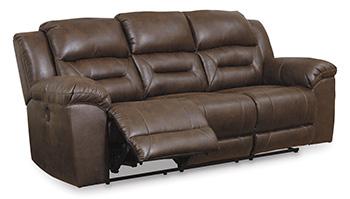 Ashley Furniture Stoneland Power Reclining Sofa with plush cushions and reclining mechanisms, shown in a modern living room setting.