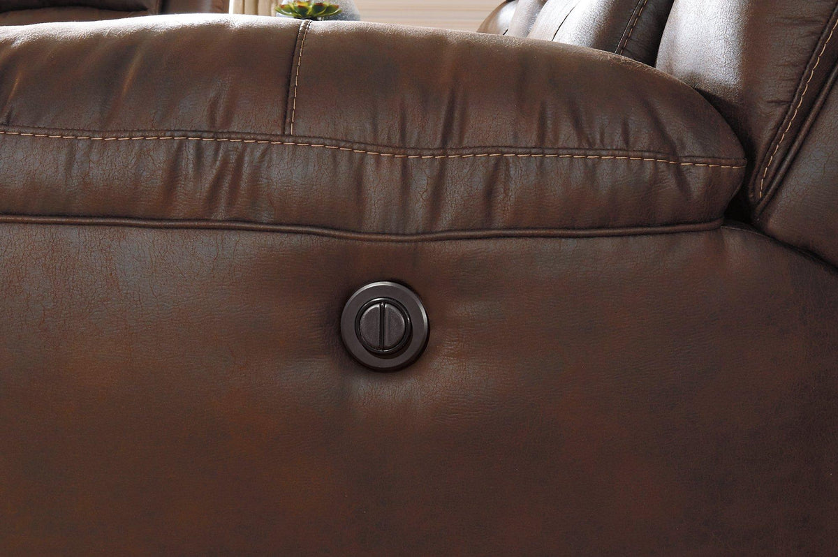 Ashley Furniture Stoneland Power Reclining Sofa with plush cushions and built-in recline mechanism, in a neutral fabric upholstery.