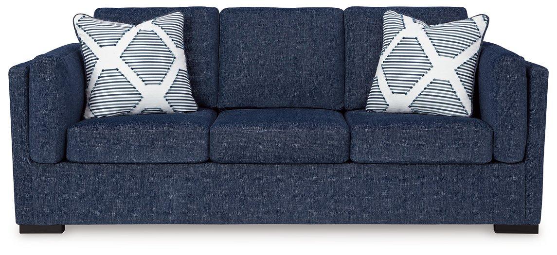 Ashley Furniture Evansley sofa with plush cushions and neutral upholstery, showcased in a modern living room setting.
